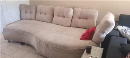 One two part couch and one sleeper wood wall unit